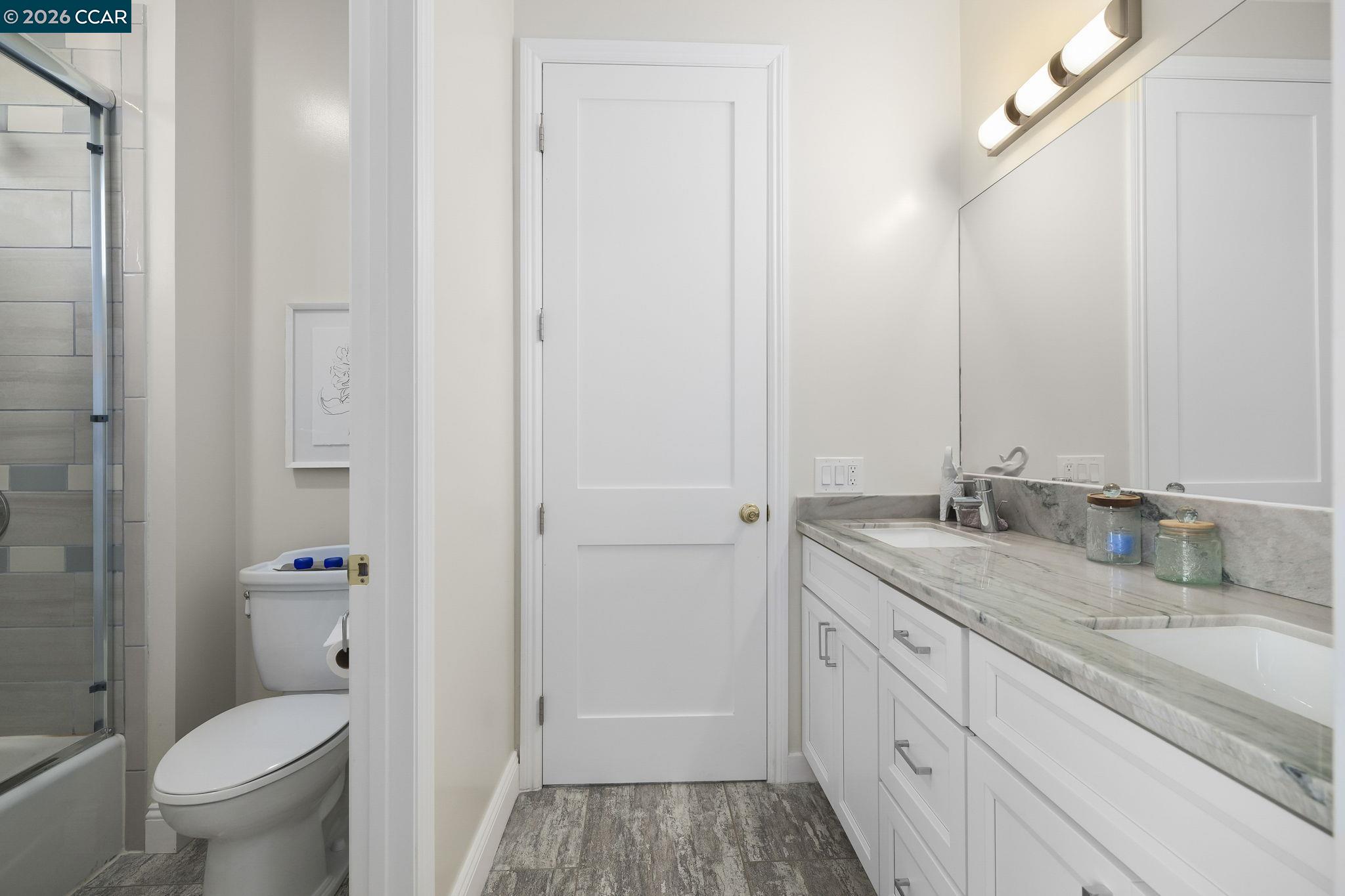 208 Valley View Place El Sobrante, CA 94803 - Photo 14 of 31 a bathroom with a granite countertop sink toilet and shower