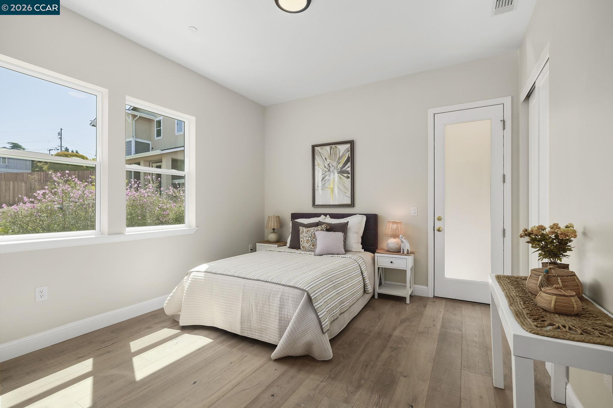 208 Valley View Place El Sobrante, CA 94803 - Photo 21 of 31 a bedroom with a bed and windows