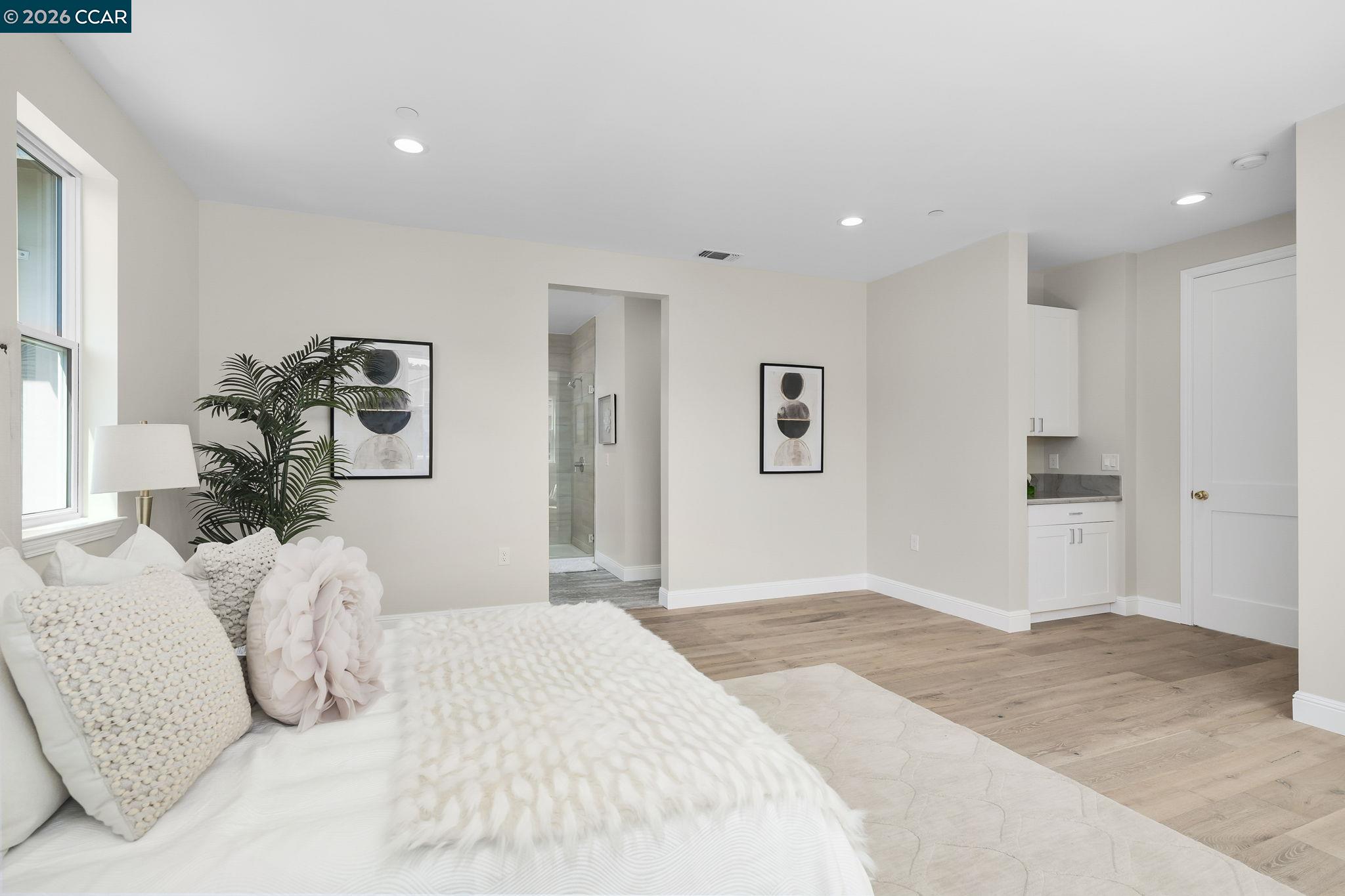 208 Valley View Place El Sobrante, CA 94803 - Photo 27 of 31 a bedroom with a large bed and a chandelier