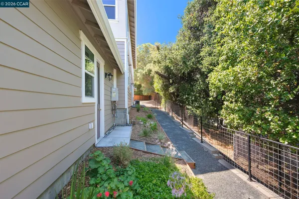a view of a pathway both side of house