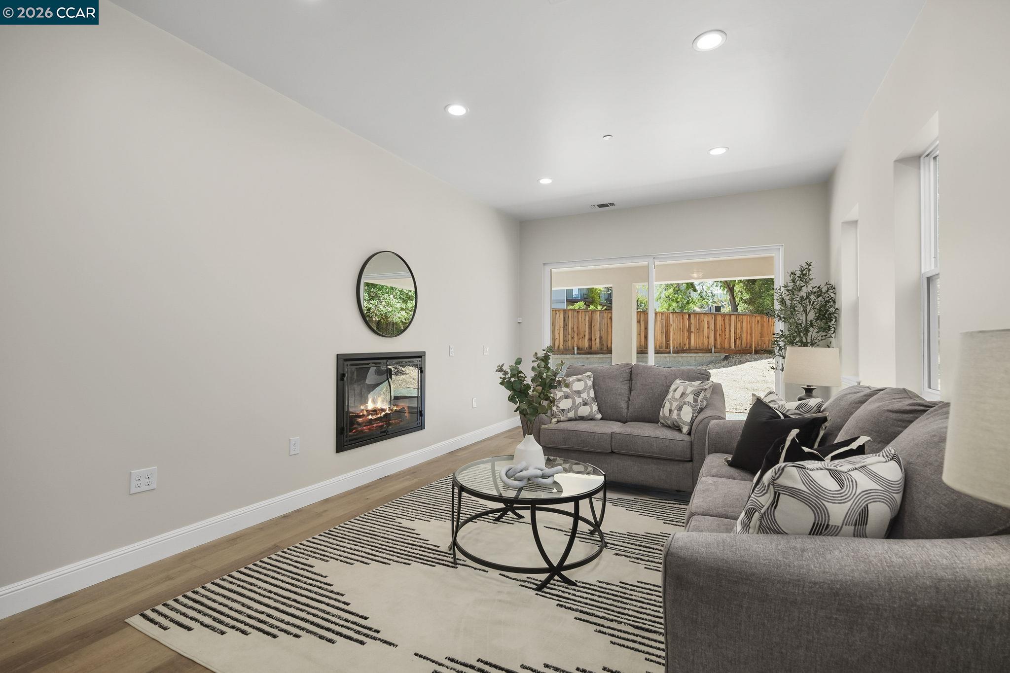 208 Valley View Place El Sobrante, CA 94803 - Photo 6 of 31 a living room with furniture and a wooden floor