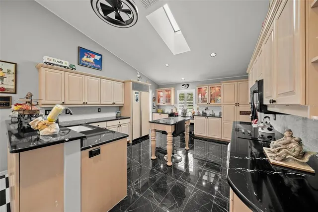 a very nice looking room with a large window and a dining table