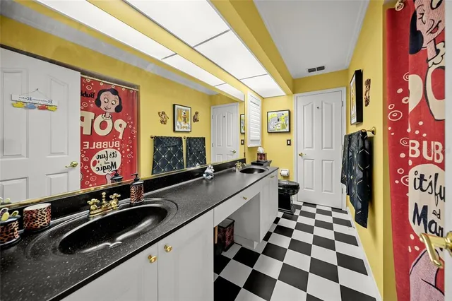 a bathroom with a sink a vanity and a mirror