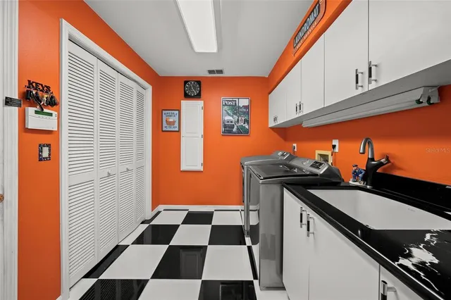 a view of a patio with dining table and chairs