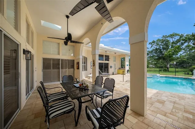 a view of a swimming pool with lounge chair