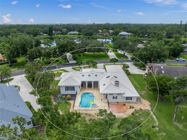 an aerial view of a house with garden space and street view