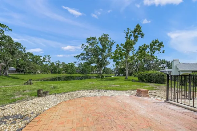 a view of a house with backyard porch and sitting area