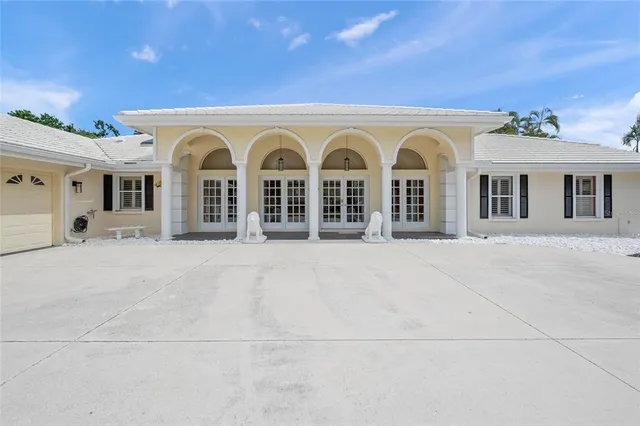a view of house with a yard