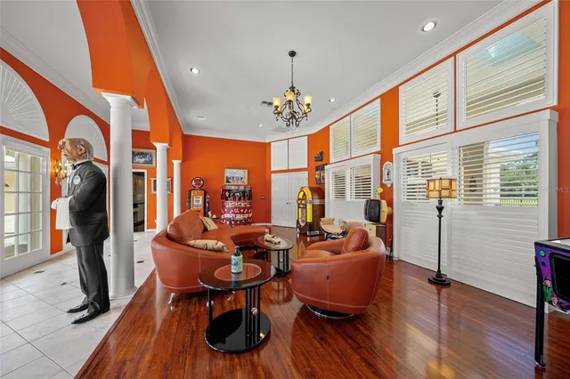 a view of living room with furniture and wooden floor