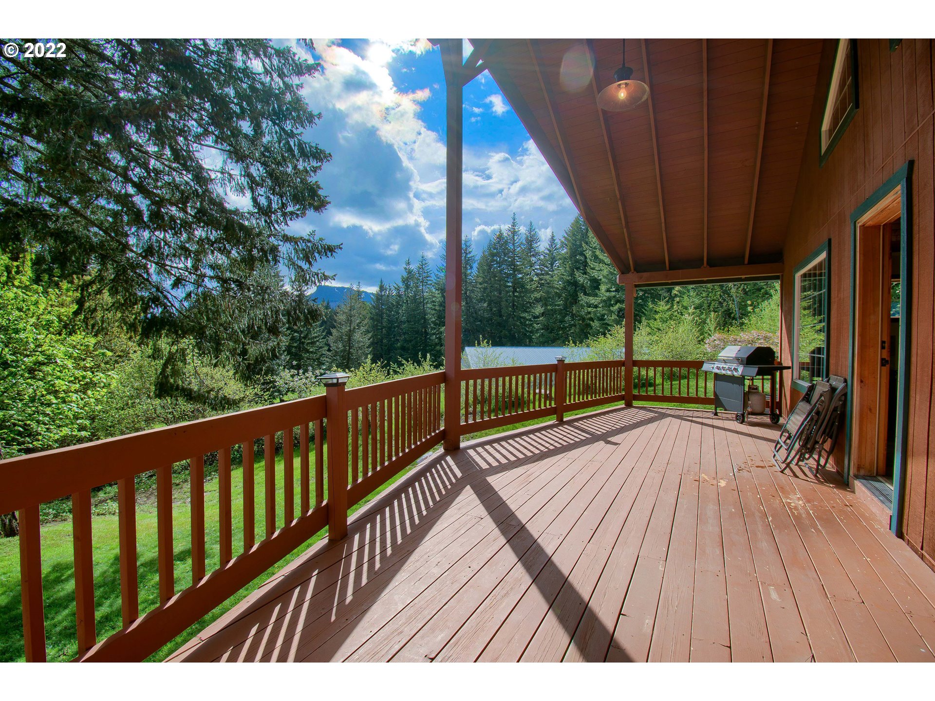 872 East Loop Road Stevenson, WA 98648 - Photo 11 of 31 a view of balcony with wooden floor and outdoor seating