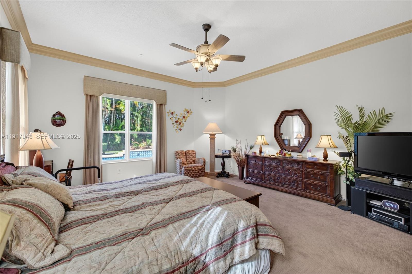 4123 West Lake Estates Drive Davie, FL 33328 - Photo 23 of 56 a bedroom with a bed and a flat screen tv