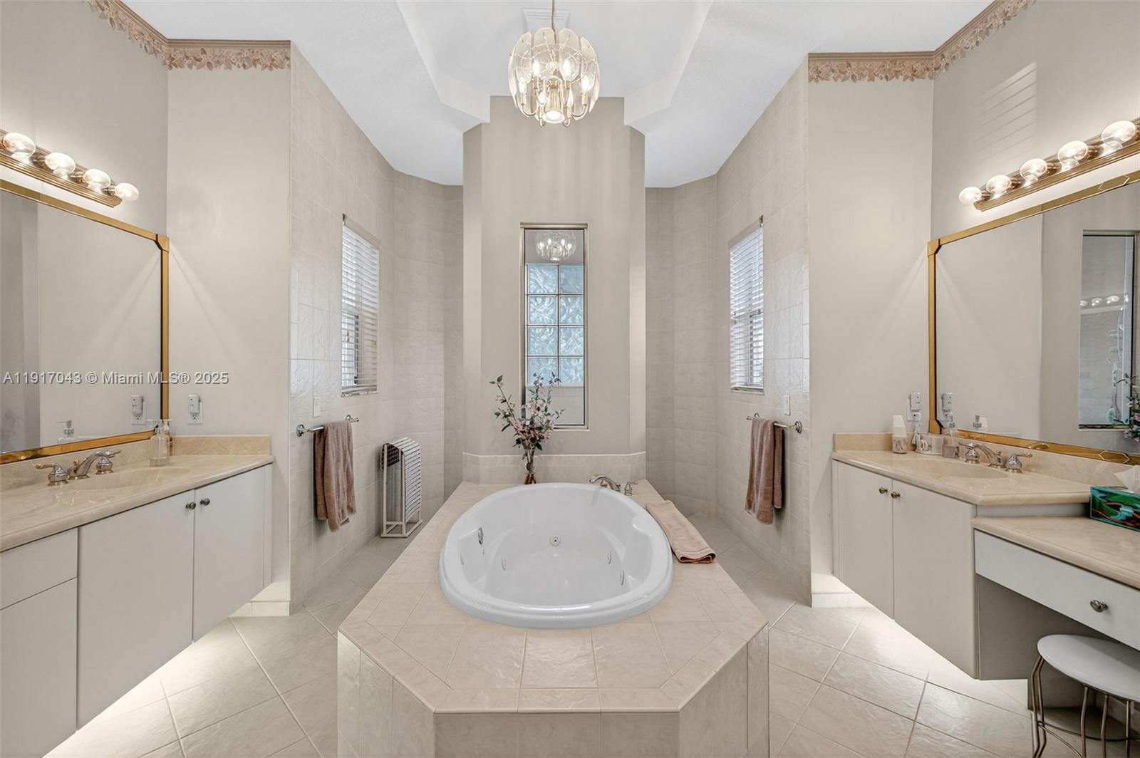 4123 West Lake Estates Drive Davie, FL 33328 - Photo 24 of 56 a spacious bathroom with a sink a tub double vanity and a mirror