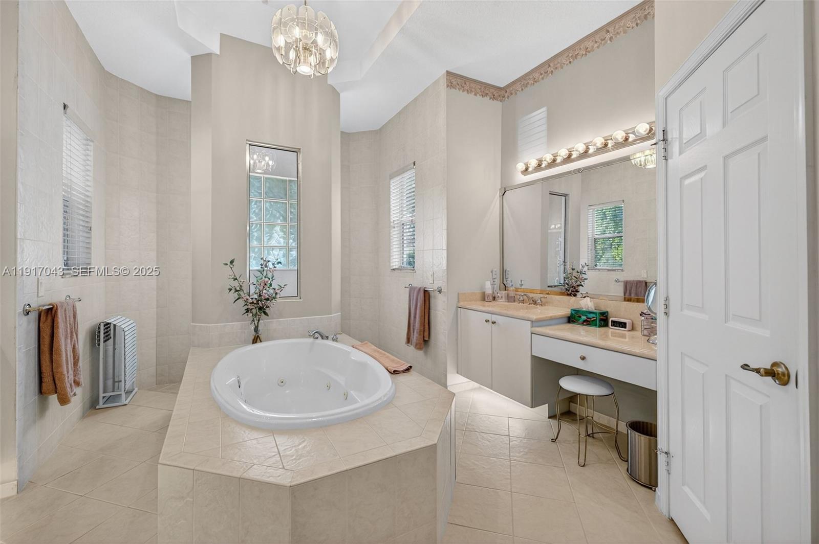 4123 West Lake Estates Drive Davie, FL 33328 - Photo 25 of 56 a bathroom with a sink double vanity and a mirror