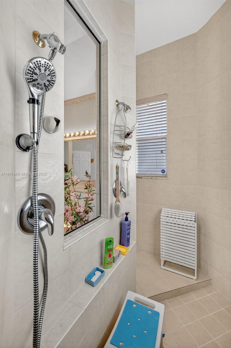 4123 West Lake Estates Drive Davie, FL 33328 - Photo 26 of 56 a bathroom with a sink and a shower