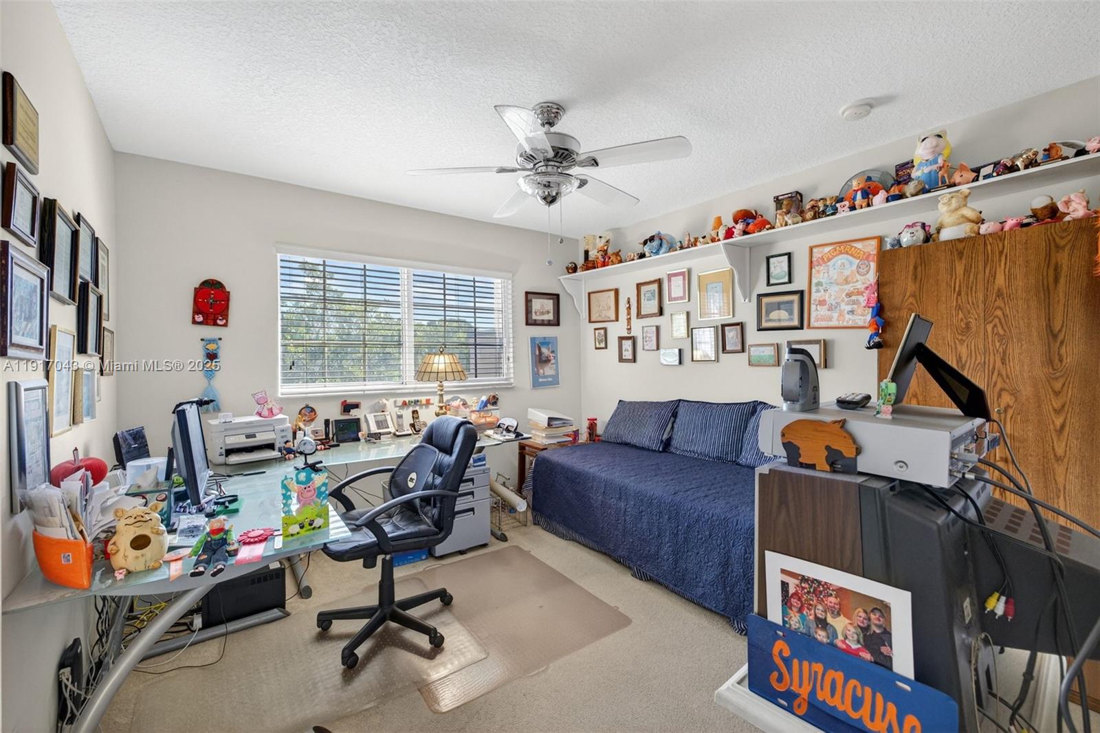 4123 West Lake Estates Drive Davie, FL 33328 - Photo 36 of 56 a living room with furniture a flat screen tv and a window