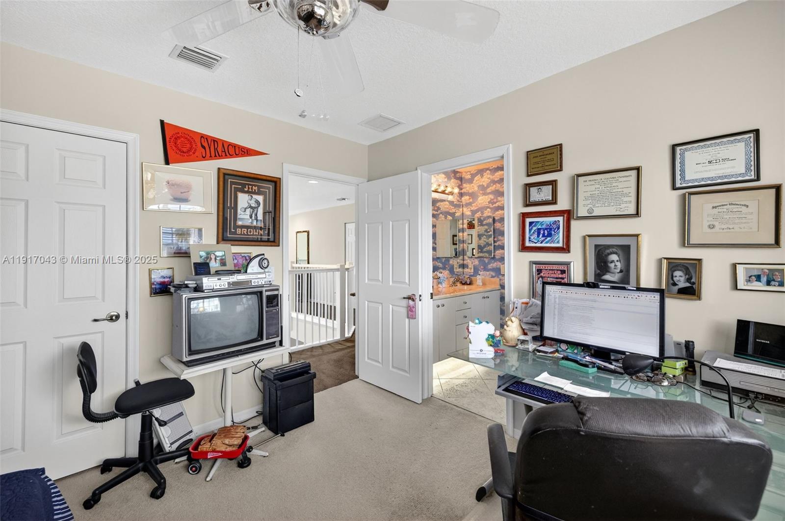 4123 West Lake Estates Drive Davie, FL 33328 - Photo 37 of 56 a workspace with furniture and floor to ceiling window