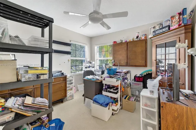 a view of backyard with seating area and green space