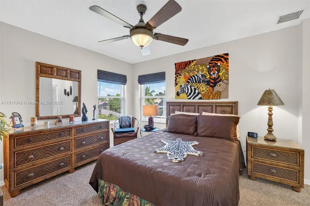 a view of a backyard with plants and a patio