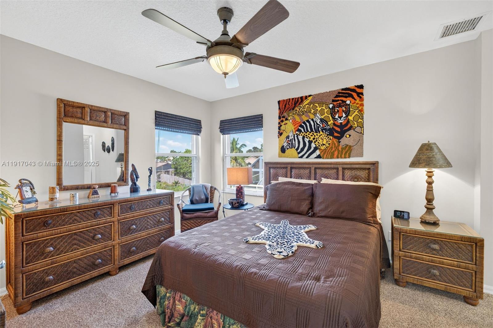 4123 West Lake Estates Drive Davie, FL 33328 - Photo 42 of 56 a bedroom with a large bed and a chandelier