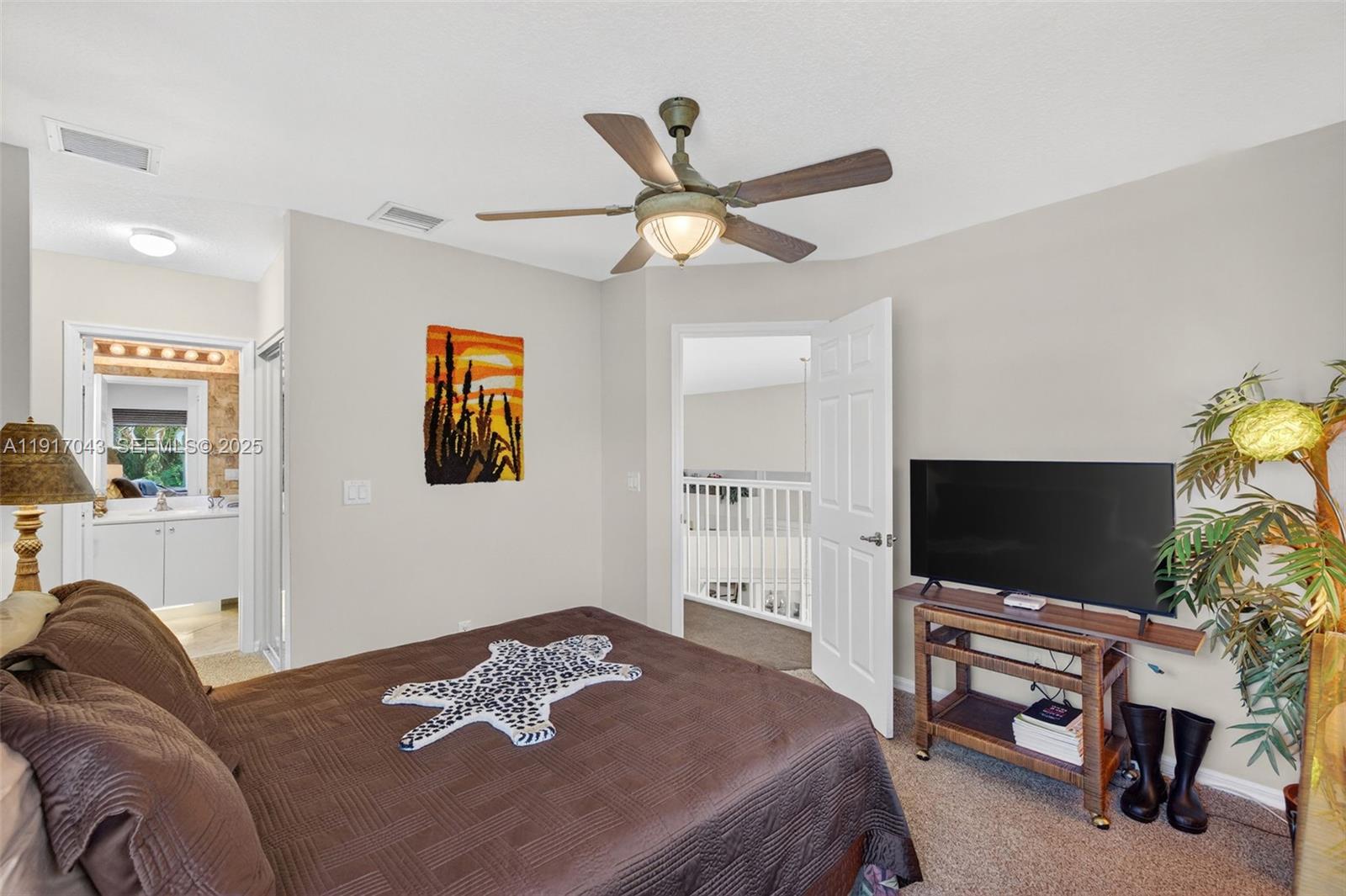 4123 West Lake Estates Drive Davie, FL 33328 - Photo 43 of 56 a bedroom with a bed and a flat screen tv