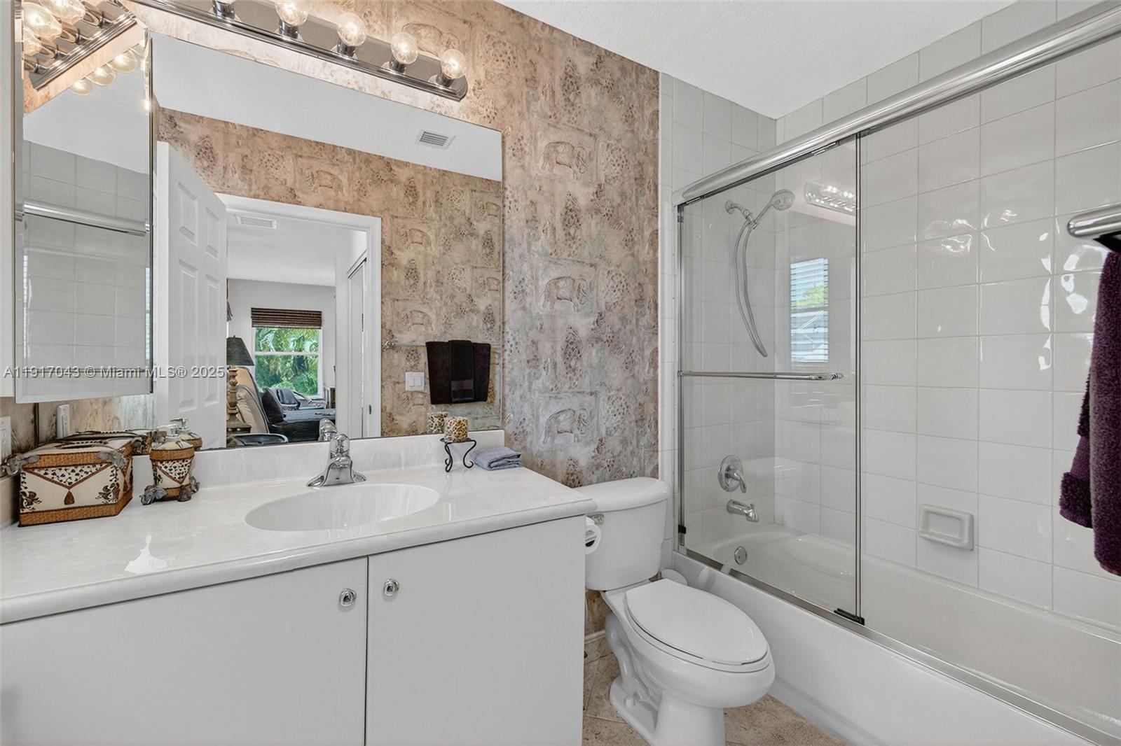 4123 West Lake Estates Drive Davie, FL 33328 - Photo 44 of 56 a bathroom with a sink a toilet and shower