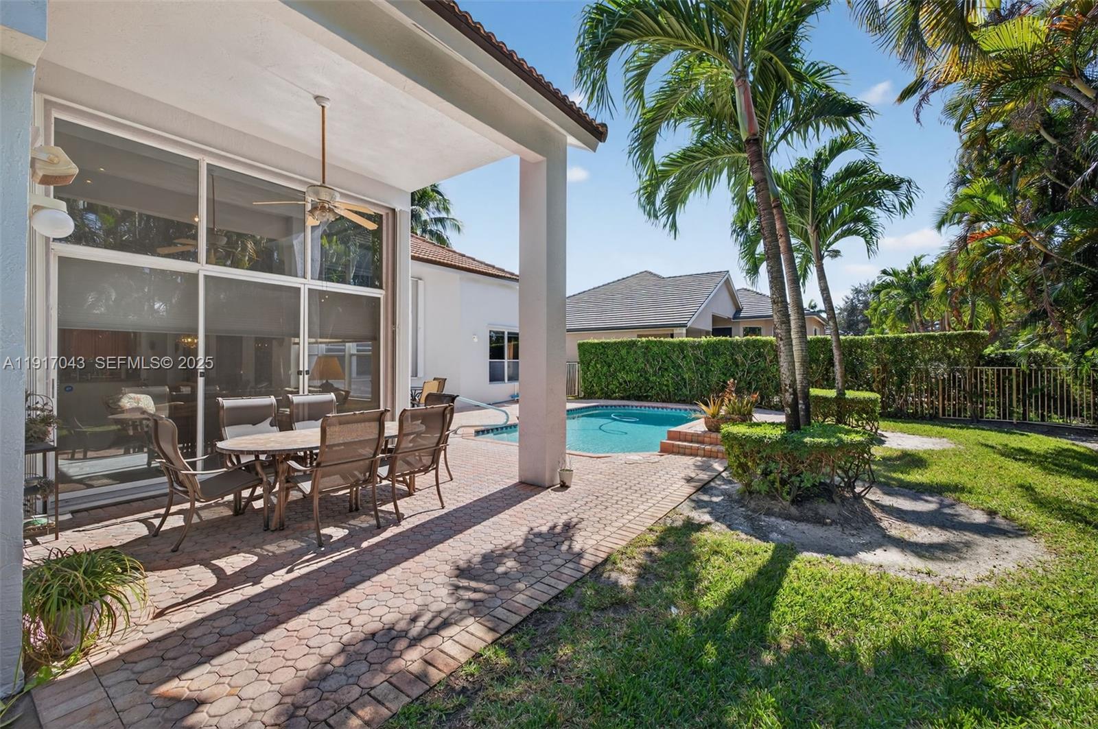 4123 West Lake Estates Drive Davie, FL 33328 - Photo 47 of 56 a view of a backyard with plants and a patio