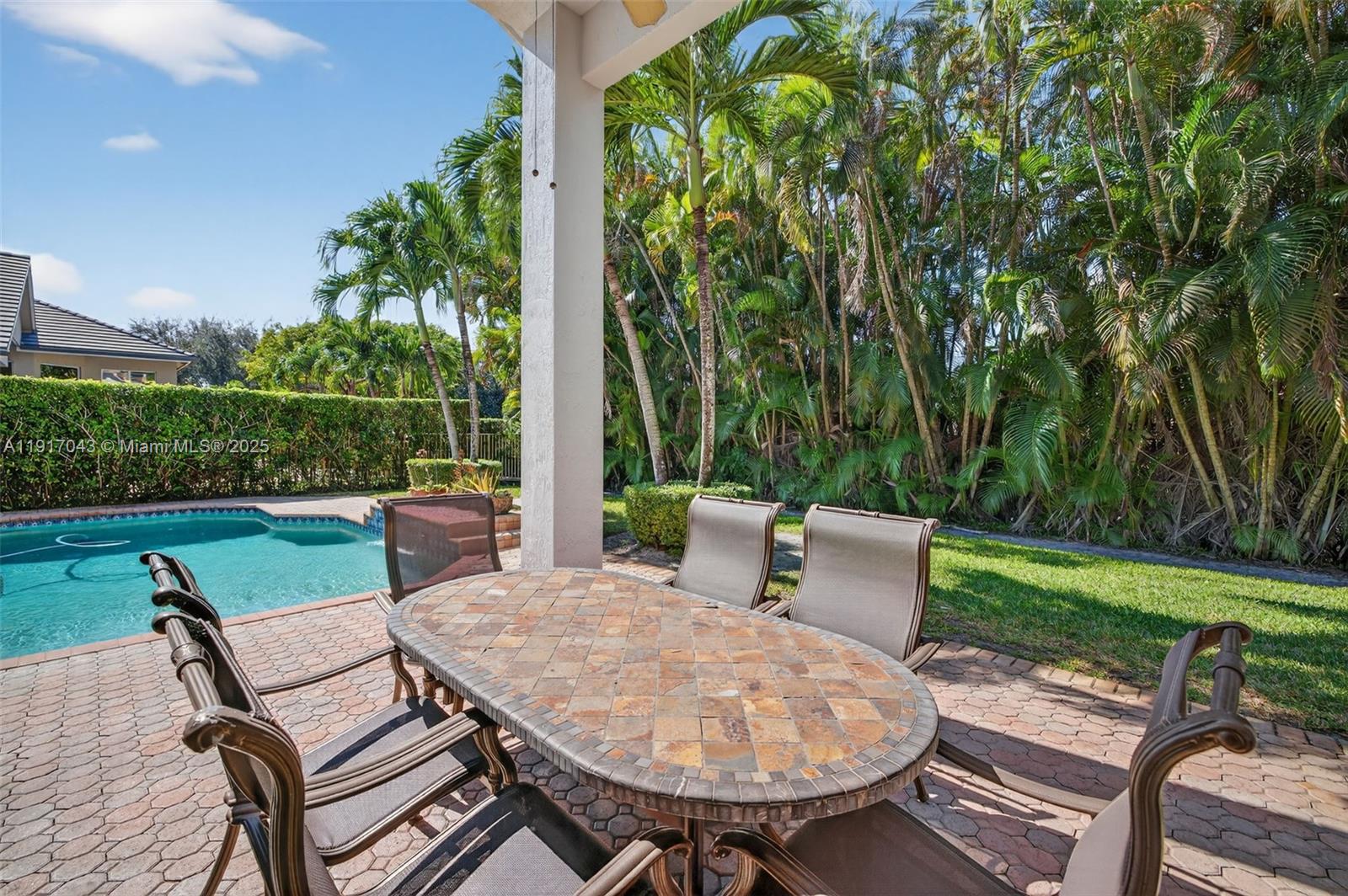 4123 West Lake Estates Drive Davie, FL 33328 - Photo 48 of 56 a view of a patio with couple of chairs