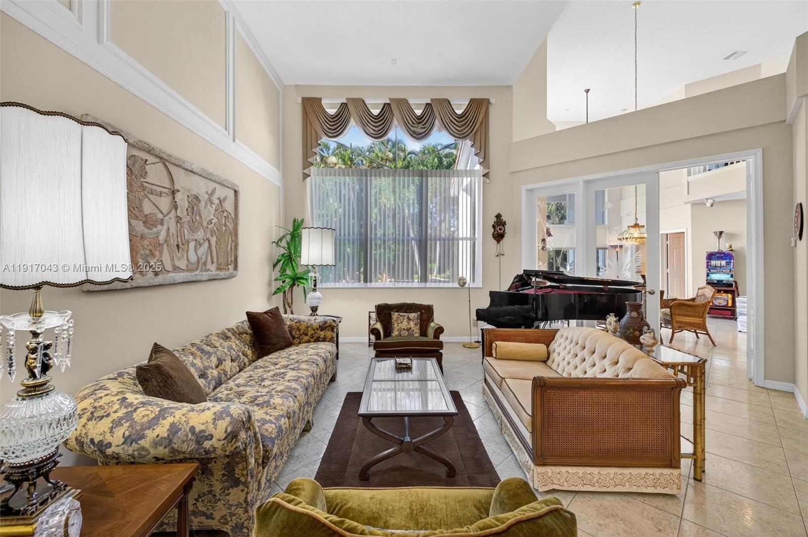 4123 West Lake Estates Drive Davie, FL 33328 - Photo 7 of 56 a living room with furniture fireplace and a window