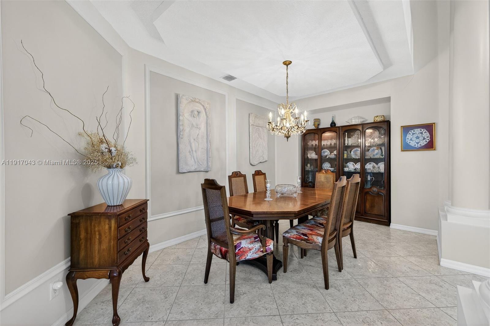 4123 West Lake Estates Drive Davie, FL 33328 - Photo 10 of 56 a view of a dining room with furniture and chandelier