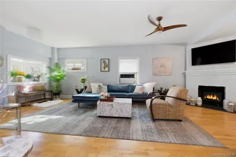 a living room with furniture fireplace and a flat screen tv