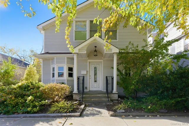 front view of a house with a yard