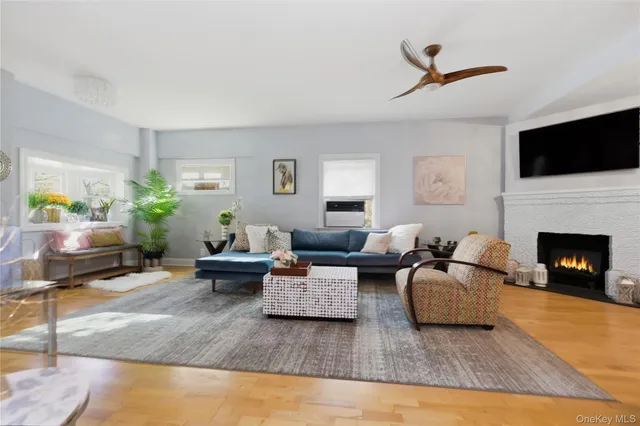a living room with furniture fireplace and a flat screen tv