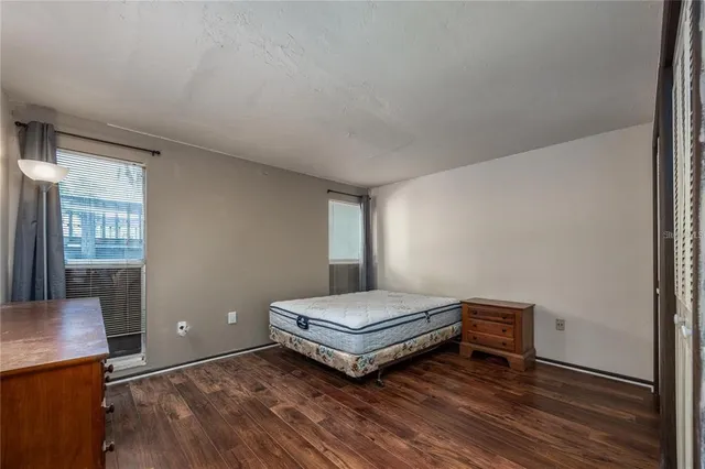 a living room with a bed furniture and a window