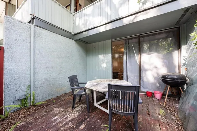 a view of a patio with a table and chairs