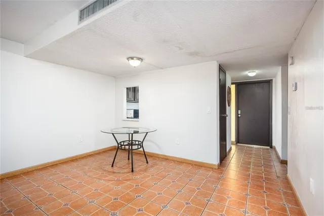 a view of a room with furniture and wooden floor