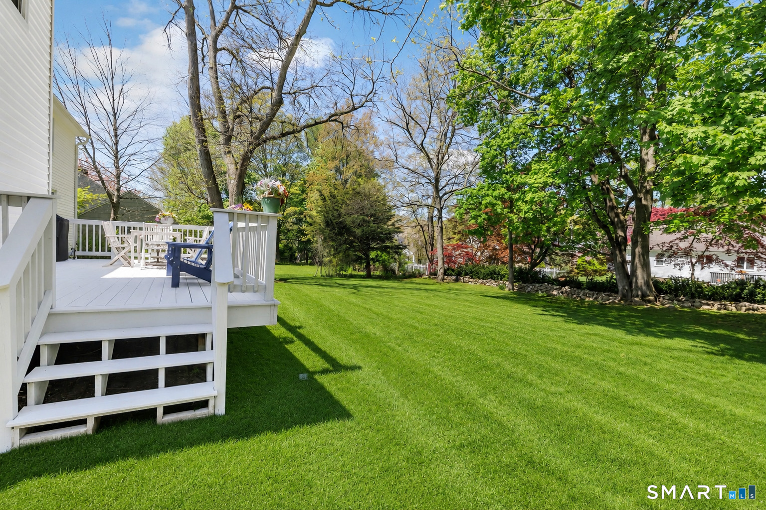 58 Colony Avenue Trumbull, CT 06611 - Photo 32 of 38 a view of a white house with a big yard and large trees