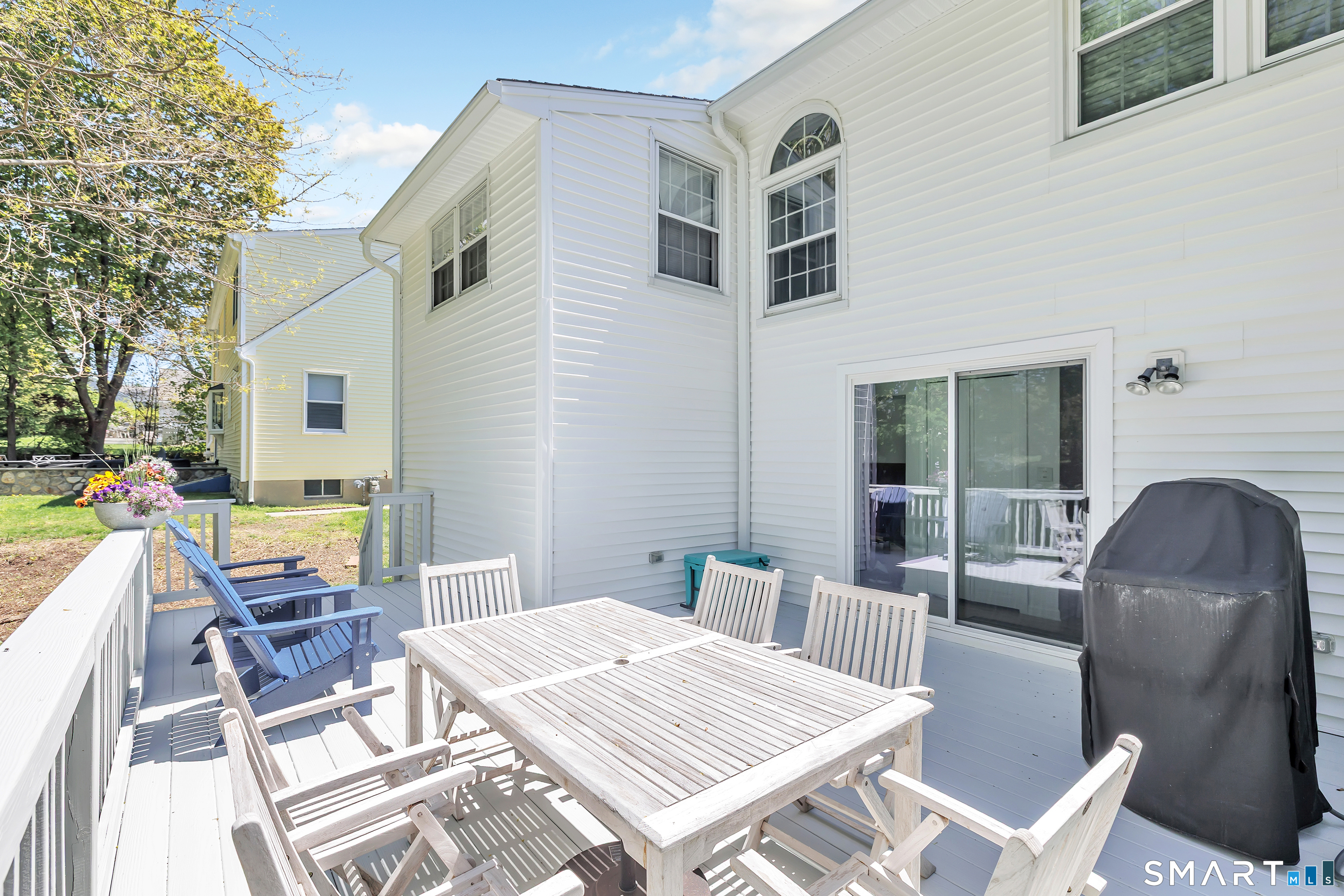 58 Colony Avenue Trumbull, CT 06611 - Photo 34 of 38 a view of a dinning tables and chairs in a patio