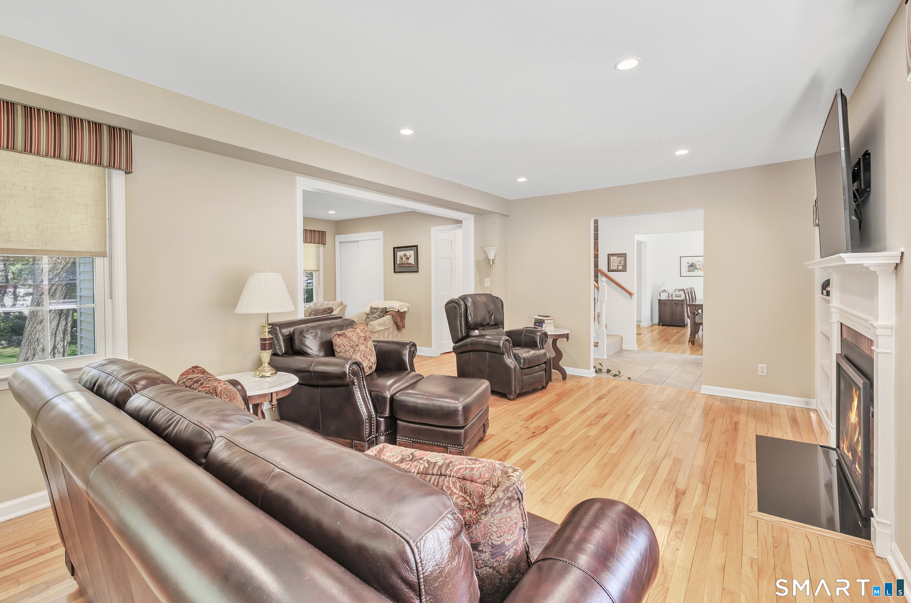 58 Colony Avenue Trumbull, CT 06611 - Photo 6 of 38 a living room with furniture fireplace and a large window