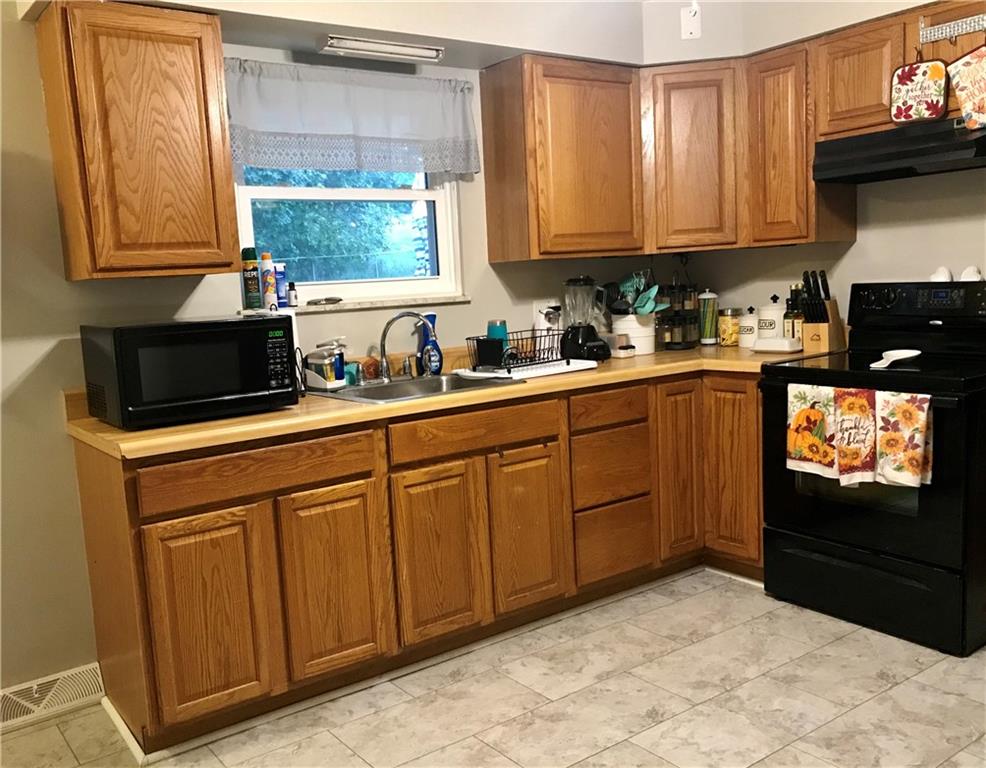 2884 South Bridge Road Washington, PA 15301 - Photo 11 of 17 a kitchen with stainless steel appliances granite countertop a sink a stove and cabinets