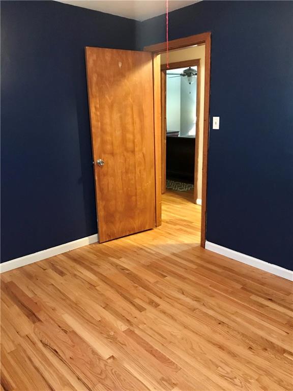 2884 South Bridge Road Washington, PA 15301 - Photo 8 of 17 a view of an empty room with wooden floor and a window