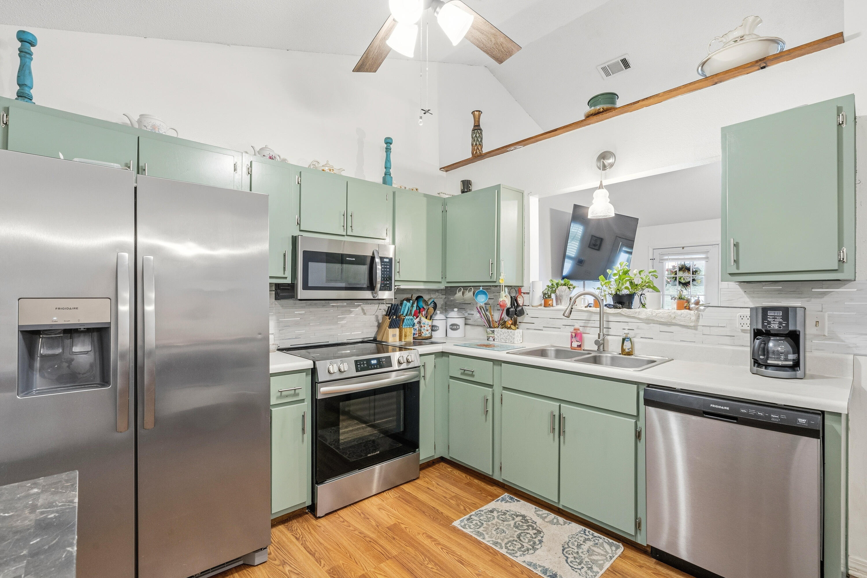 2880 Aplin Road Crestview, FL 32539 - Photo 13 of 33 a kitchen with a sink stainless steel appliances and cabinets