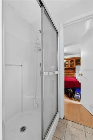 a kitchen with granite countertop a sink a counter space appliances and cabinets
