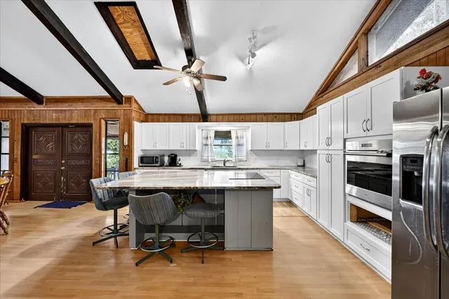 a living room with a couch and a chandelier
