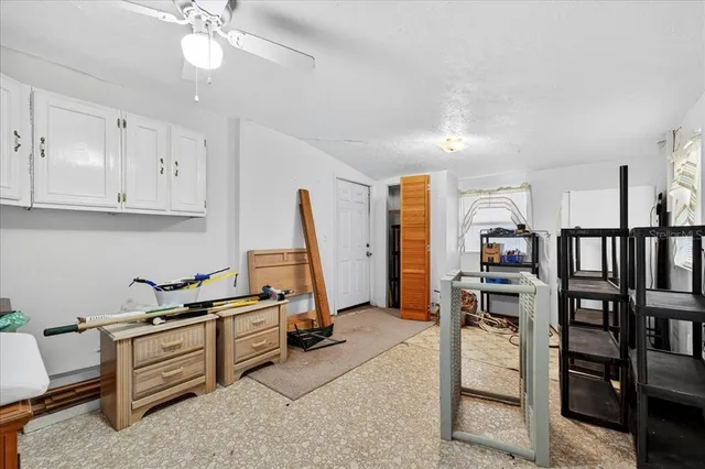 a living room with lots of furniture and white walls