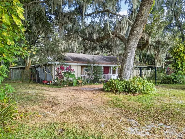 a kitchen that has a sink and a stove in it