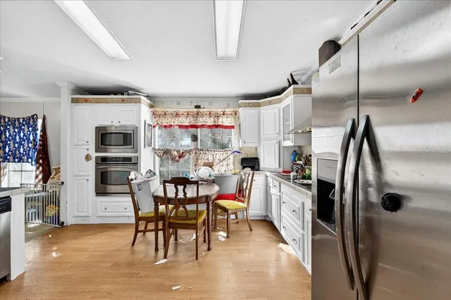 a bedroom with a bed and a flat tv screen in it