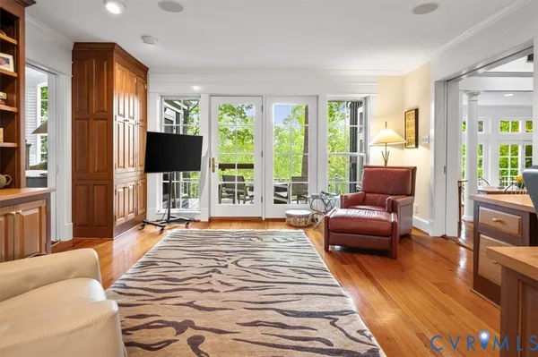 a bedroom with furniture and wooden floor