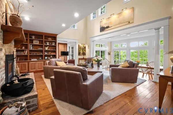 a living room with fireplace furniture and a fireplace