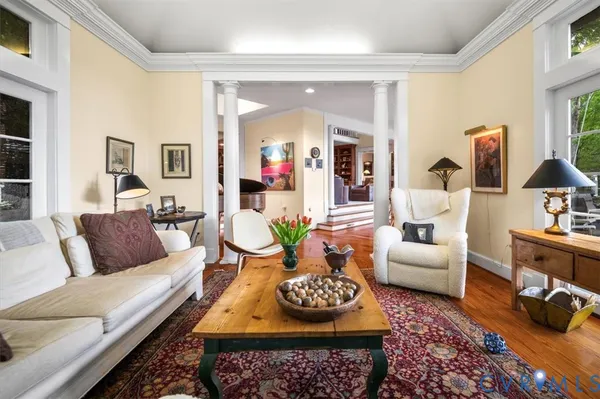 a living room with furniture and a rug