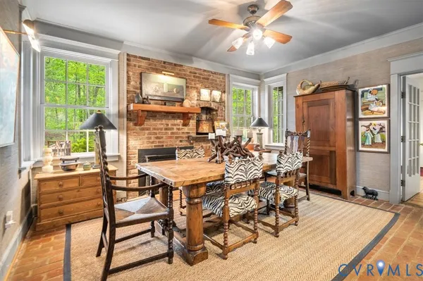 a view of a dining room with furniture window and outside view
